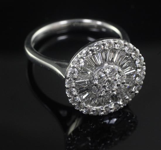 A modern 18ct white gold and diamond cluster dress ring, size O.
